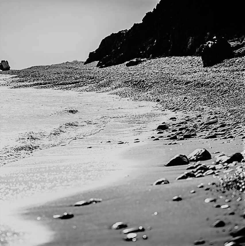 Strand und Steine ls Sinnbild für einen Motivationsspruch